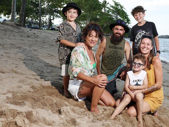 One year on from the flood that devastated the Holloways Beach community, an informal gathering was orgaised for locals on the beachfront to gather, talk and support one another. Organiser Crystal MacLennan and her nephew Archie Hughes, 7, pictured with flood survivors Carter Edwards, Dan Cairns, Sami Keeble and her son Lance Keeble, 6, pictured on Holloways Beach. Picture: Brendan Radke