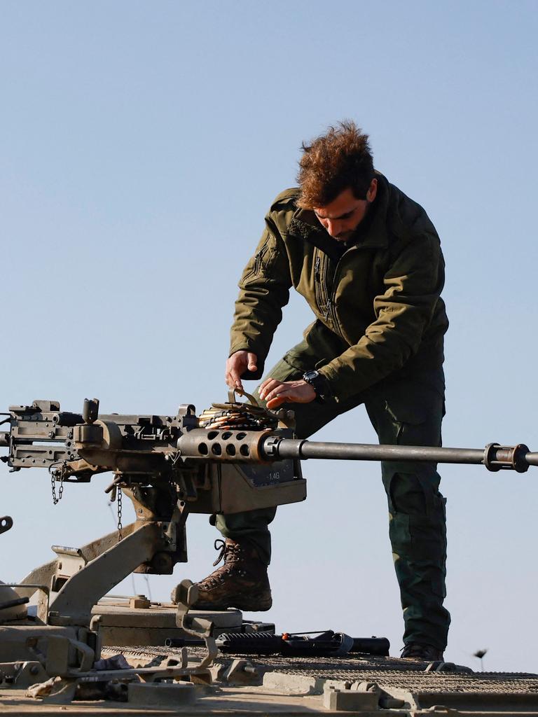 An Israeli soldier checks a weapon at a position in the Israel-annexed Golan Heights near the border with Syria. Picture: Jalaa Marey/AFP