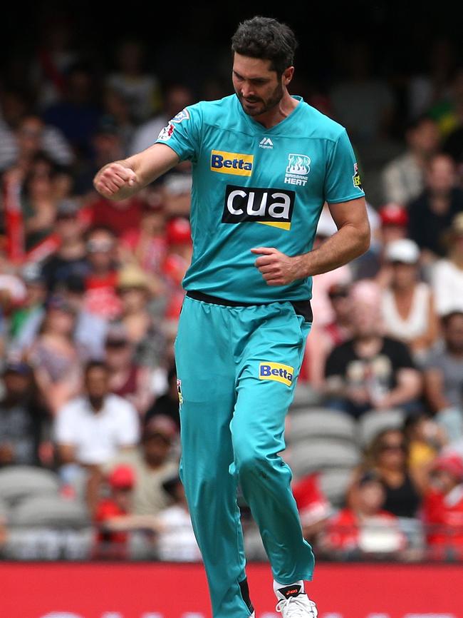 Ben Cutting enjoys a wicket during his time with Brisbane Heat.