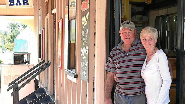 Publicans Bernie and Debbie Kerr serve their last drinks at the Linville Hotel after nearly 36 years in the business. Picture: Contributed