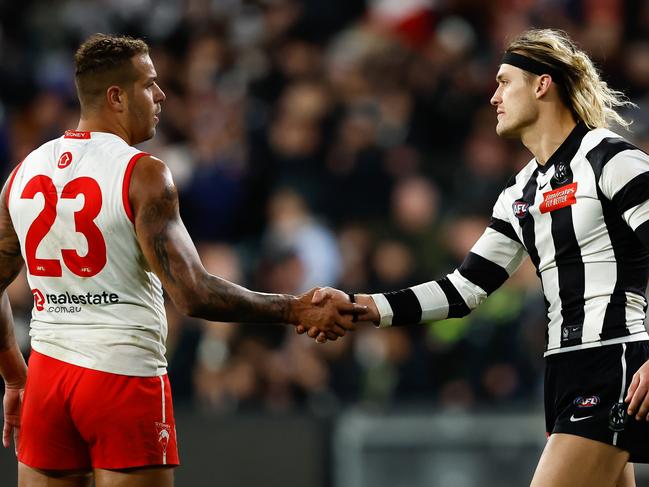 MELBOURNE, AUSTRALIA - MAY 07: Lance Franklin of the Swans and Darcy Moore of the Magpies shake hands after the final siren during the 2023 AFL Round 08 match between the Collingwood Magpies and the Sydney Swans at the Melbourne Cricket Ground on May 7, 2023 in Melbourne, Australia. (Photo by Dylan Burns/AFL Photos via Getty Images)