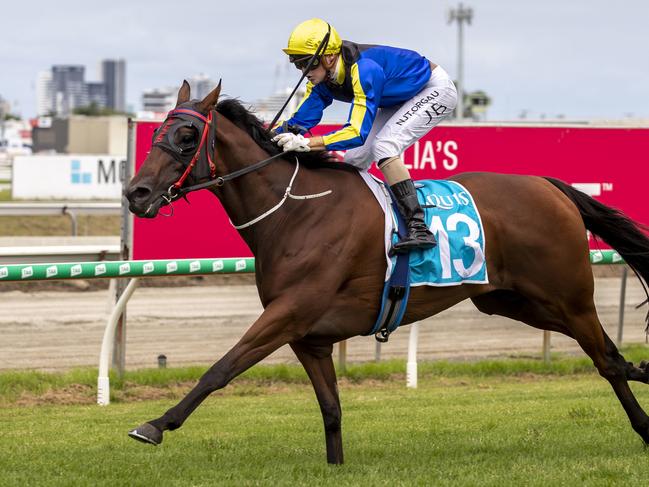 Jake Bayliss rides Motion Granted to victory in race 2, the Sunshine Coast Scorchers Colts, Geldings and Entires Benchmark 72 Handicap, during the QTIS Jewel Raceday at Aquis Park on the Gold Coast, Saturday, March 14, 2020. (AAP Image/Glenn Hunt)