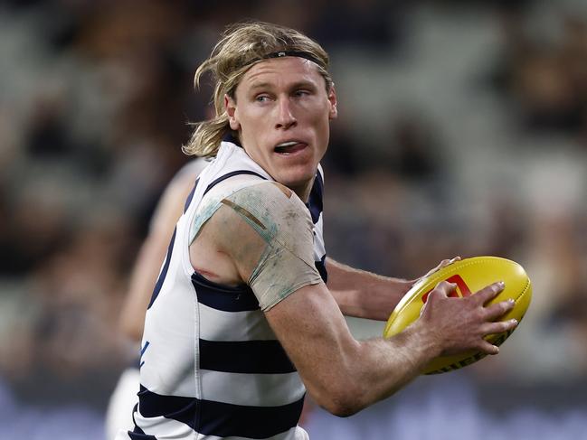 MELBOURNE, AUSTRALIA - JULY 16: Mark Blicavs of the Cats runs with the ball during the round 18 AFL match between the Carlton Blues and the Geelong Cats at Melbourne Cricket Ground on July 16, 2022 in Melbourne, Australia. (Photo by Darrian Traynor/Getty Images)