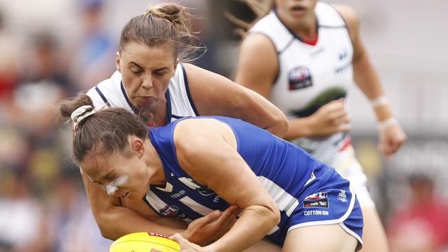 Crow Ebony Marinoff nails North’s Danielle Hardiman with a strong tackle. Picture: AAP