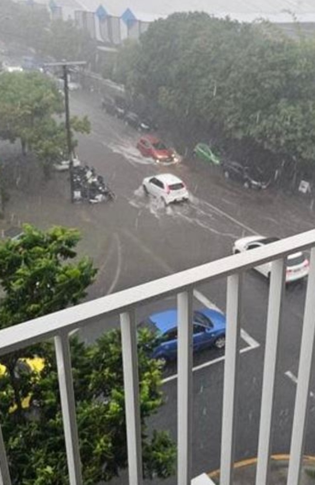 Cars inundated on Montague Rd at West End.