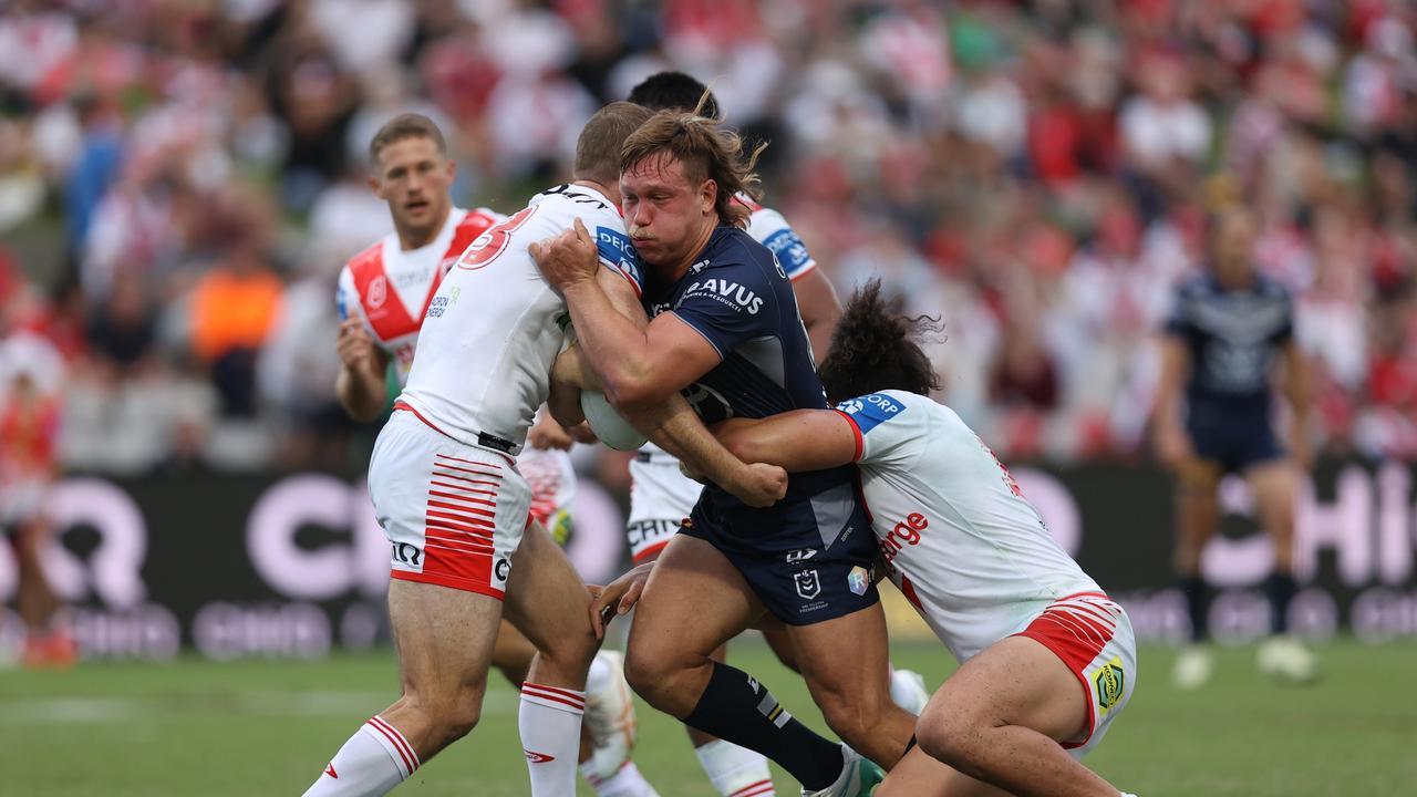 Reuben Cotter is tackled against the Dragons. (Photo by Jason McCawley/Getty Images)