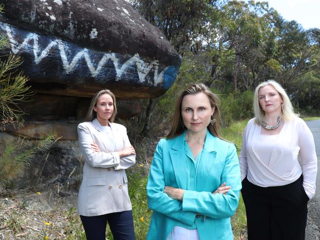 Jacqui Scruby (left), the independent candidate for Pittwater, Joeline Hackman (centre), the independent candidate for Manly, and Sarah Baker the Wakehurst’s Independent spokeswoman at Lizard Rock in Belrose, the site of a proposed contentious residential subdivision at Belrose. Picture: John Feder