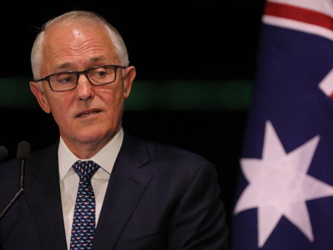 Australia's Prime Minister Malcolm Turnbull delivers a speech during a dinner held to honour France's President Emmanuel Macron at the Sydney Opera House in Sydney on May 1, 2018. Macron arrived in Australia on May 1 on a rare visit by a French president with the two sides expected to agree on greater cooperation in the Pacific to counter a rising China. / AFP PHOTO / LUDOVIC MARIN