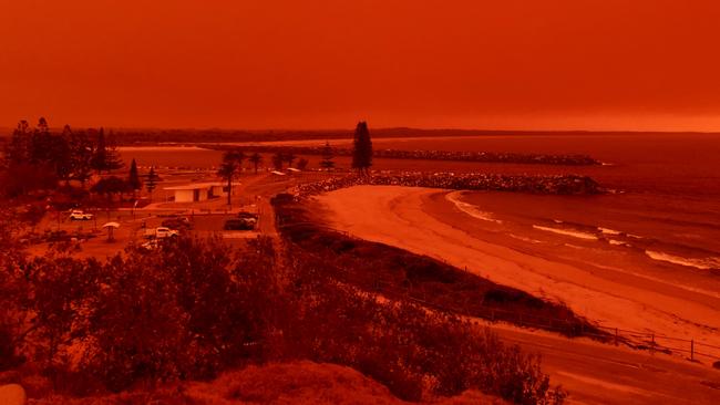 The sky turns red from bushfires burning close to Port Macquarie. Picture: Kylie Edwards