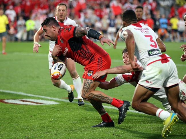 Tonga's Andrew Fifita loses the ball as he scores a try that was denied in the dying seconds.