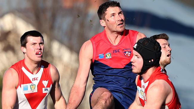 Colin Garland sends the ball past Brady Jones. Picture: NIKKI DAVIS-JONES