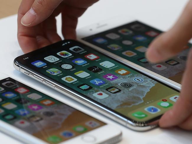 CUPERTINO, CA - SEPTEMBER 12: (L-R) The new iPhone 8, iPhone X and iPhone 8S are displayed during an Apple special event at the Steve Jobs Theatre on the Apple Park campus on September 12, 2017 in Cupertino, California. Apple held their first special event at the new Apple Park campus where they announced the new iPhone 8, iPhone X and the Apple Watch Series 3.   Justin Sullivan/Getty Images/AFP == FOR NEWSPAPERS, INTERNET, TELCOS & TELEVISION USE ONLY ==