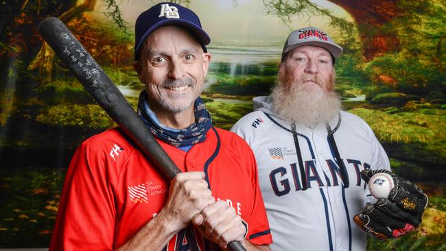 Baseball fan Andrew Sutton, left, who was diagnosed with terminal cancer in April, had a training session with the Adelaide Giants with his mate Danny Hicks, right. Picture: NCA NewsWire / Brenton Edwards