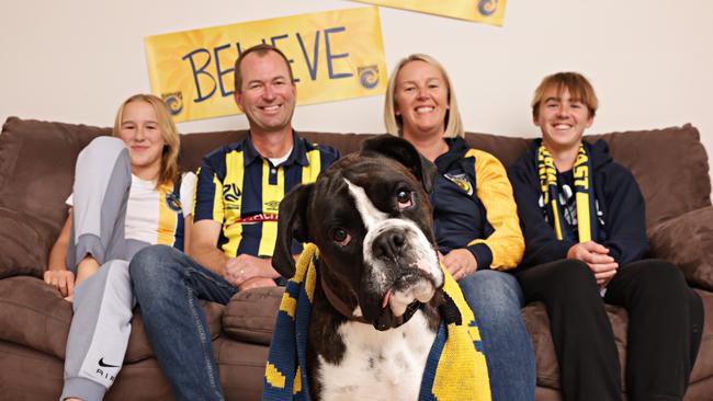 A very excited Flick family can’t wait to see their team in the Grand Final: (l to r) Grace, 10, Andrew, Rowdy the dog, Janene and Samuel Flick, 13. Picture: Adam Yip