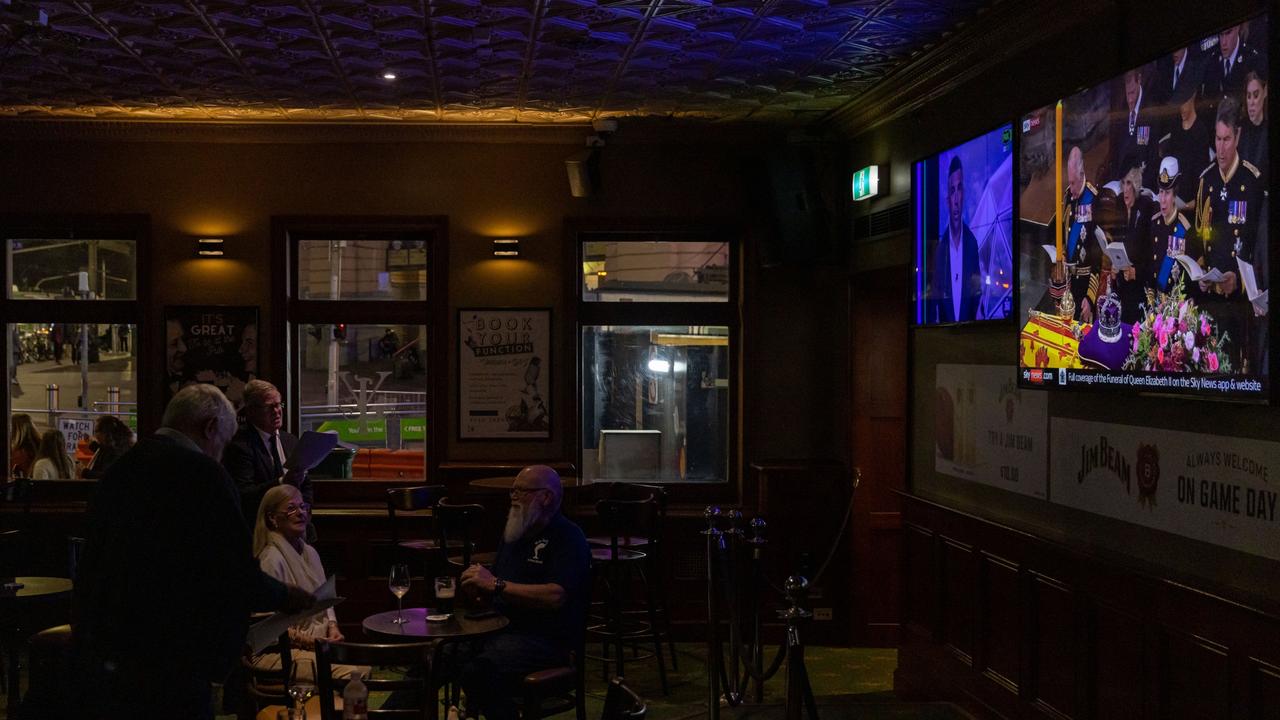 Melbourne, Australia: Patrons sing a hymn during the telecast of the Queen Elizabeth II funeral being telecast at the Young &amp; Jacksons Pub. Picture: Getty Images