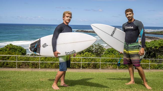 Hugo Szwec and Oscar Leclair hit the surf at Duranbah Beach ahead of the Qld-NSW border closing. Picture: Glenn Hunt