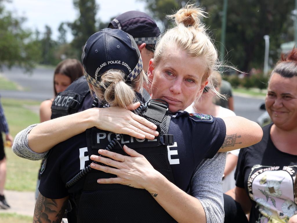 Local resident Angie Fraser-Parle hugs a Tara police officer in thanks. Picture: Liam Kidston