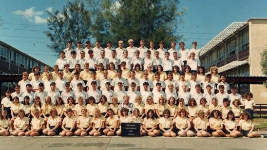 Melissa Caddick’s high school class photo from 1988. She is seated in the bottom row, third from right, with the curly hair.