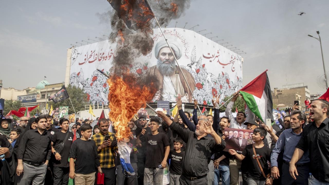 Iranians burn the Israeli flag during the funeral ceremony of Hamas leader Ismail Haniyeh in Tehran. Picture: Getty