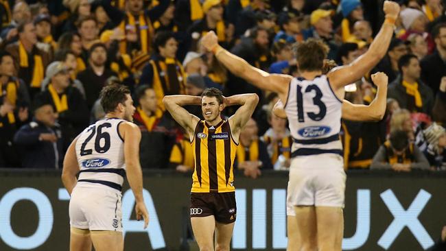 Geelong players celebrate after Issac Smith misses after the siren. Picture: Wayne Ludbey