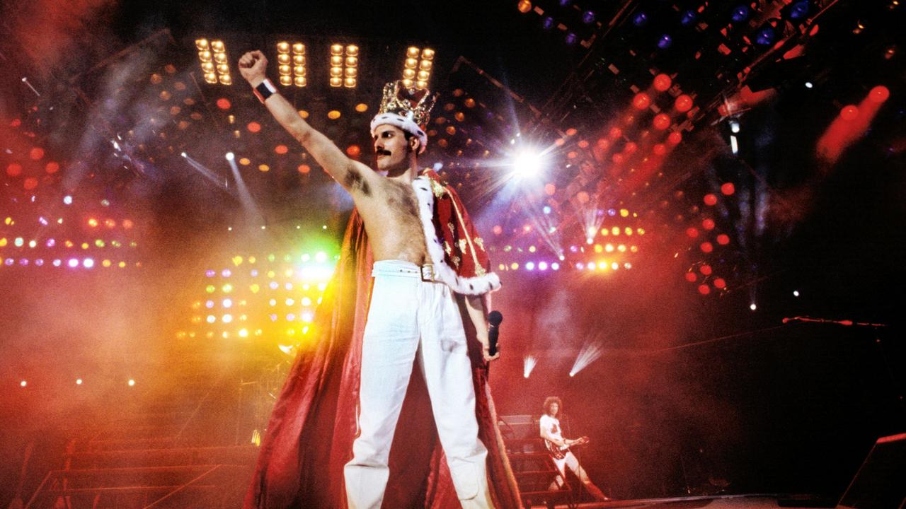 What three hit songs by Queen are popular sporting anthems?