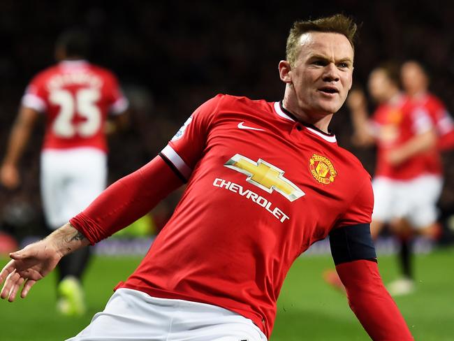 MANCHESTER, ENGLAND - MARCH 09: Wayne Rooney of Manchester United celebrates after scoring a goal to level the scores at 1-1 during the FA Cup Quarter Final match between Manchester United and Arsenal at Old Trafford on March 9, 2015 in Manchester, England. (Photo by Laurence Griffiths/Getty Images)