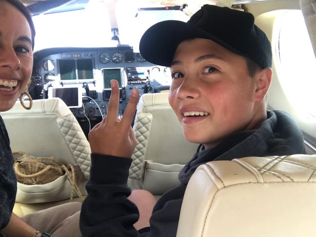 Kobi on board an Angel Flight on the way to Cobar, NSW, to meet his mum. Picture: Supplied