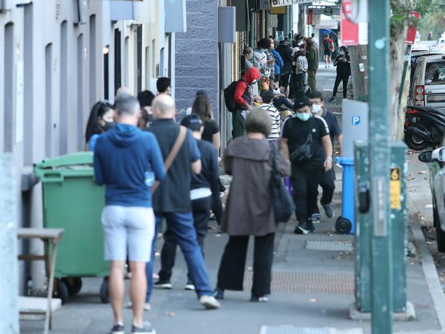 A long queue forms outside the Darlinghurst Centrelink office at around 7.30am this morning. Long before the office is due to open. Picture Rohan Kelly