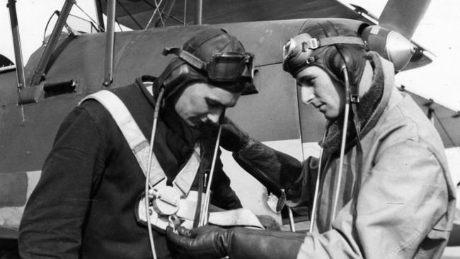 Empire Air Training Scheme trainee, Cadet Harry Dawkins, of Gawler, receives parachute instruction from Flying Officer R. H. Gibbons. File picture