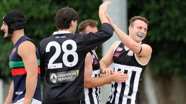 Jack Newman, Ned Wilson and Billy Hansen celebrate a Moonee Valley goal. Picture: Jamie Morey