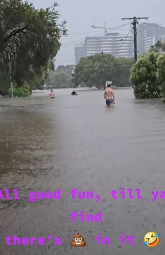 Men seen playing in the Brisbane flood water. Picture: TikTok/yippeedo5