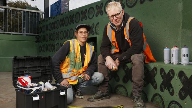 Alice Holmes with Reuben Topski are creating artwork ahead of National Homelessness Week at Rosny skate park. Picture: Nikki Davis-Jones