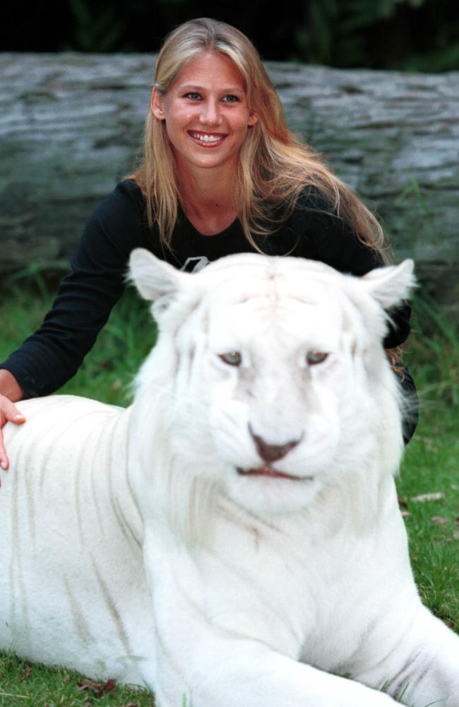 Anna Kournikova makes friends with Taj the tiger during a visit to Dreamworld on the Gold Coast, Australia. Picture: Darren England/ALLSPORT