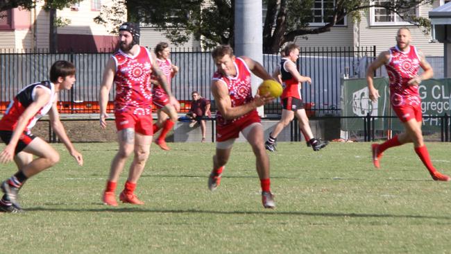 FINESSE: Swans trio Josh McGuinness and Andrew Baker out manoeuvre their opposition while captain Eoghan McNutt provides support from behind during the Sir Doug Nicholls Round on May 29, 2021. Photo: Alison Paterson