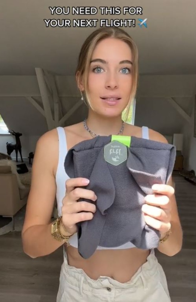 US influencer Lou swears by the TRTL Travel Pillow, saying it gave her the ‘best’ sleep on a recent flight. Picture: TikTok/lostlikelou