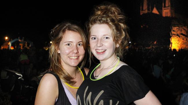 Emma Johnson, 14, and Kate Pearson, 14, both of Ipswich at the 2010 New Year’s Eve celebration at Timothy Moloney Park, Woodend. Picture: David Nielsen