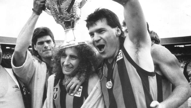 Gary Ayres (left) celebrates Hawthorn’s 1989 premiership with John Platten and Jason Dunstall.