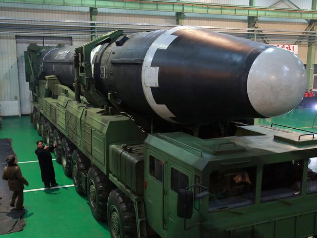 North Korean leader Kim Jong-un inspects the Hwasong-15 intercontinental ballistic missile prior to its launch last week. Picture: KCNA/AP