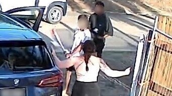 Two women were threatened by a gang of violent youths armed with a baseball bat for their car outside a home in Belgian Gardens on December 7.