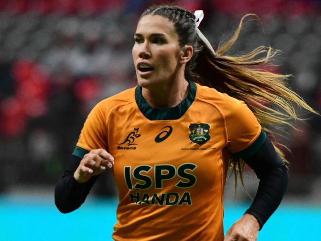 Australiaâs Charlotte Caslick in action during the 2024 HSBC Canada Sevens rugby tournament match between Australia and Fiji at BC Place Stadium in Vancouver, Canada, on February 23, 2024. (Photo by Don MacKinnon / AFP)