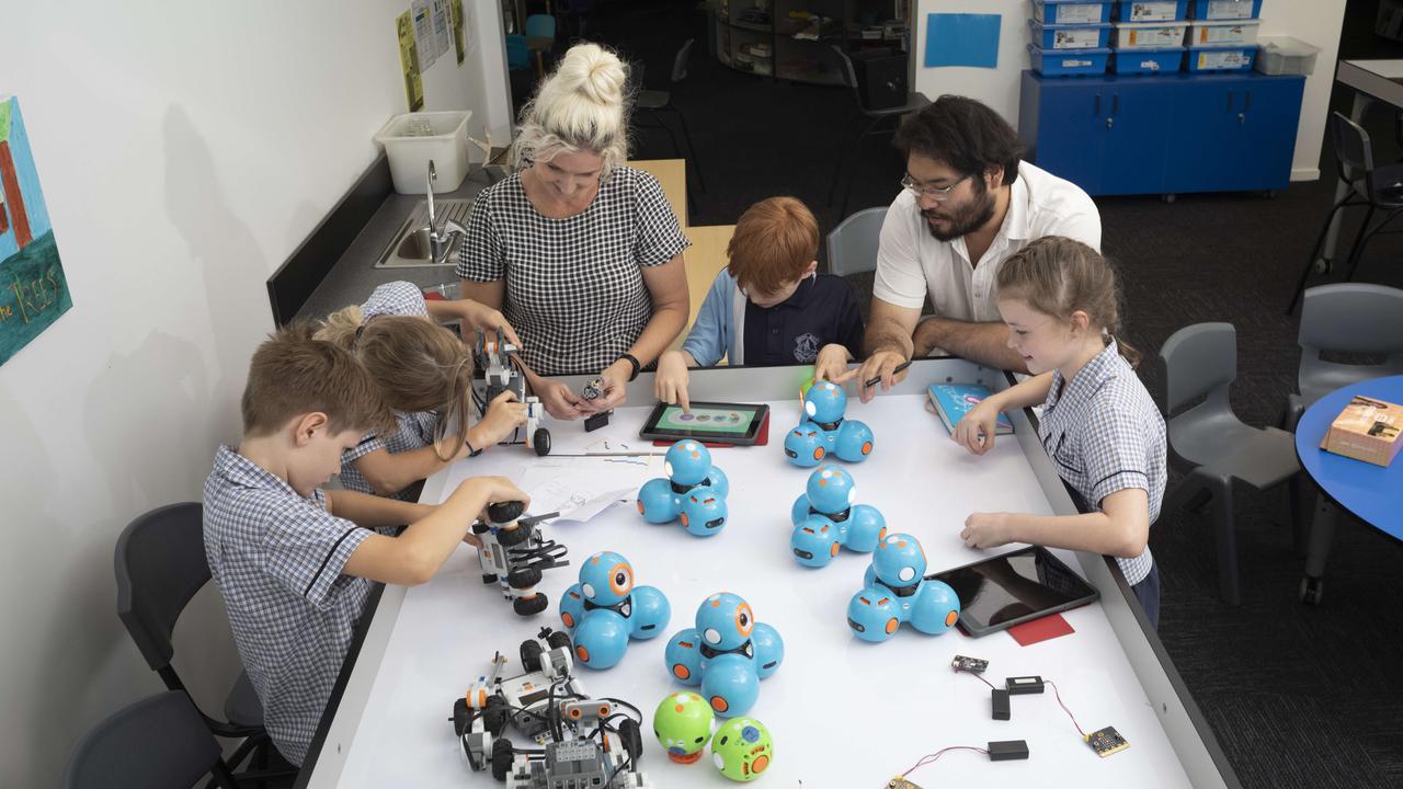 Students at Payne Rd State School working on a project for Curiocity with Engineer Educator Wilson Kong and Art and Technology Teacher Shannon Gibs. Picture: Russell Shakespeare