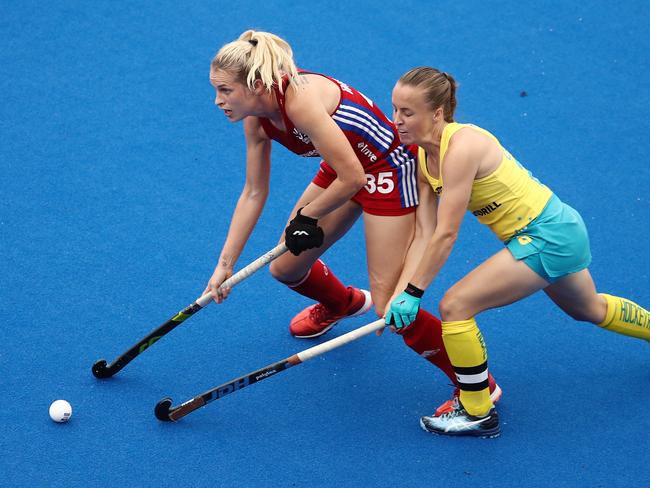 Leah Wilkinson of Great Britain competes with Kate Jenner of the Hockeyroos during the FIH Pro League match between the Hockeyroos and Great Britain at Sydney Olympic Park Hockey Centre in Sydney, Sunday, February 2, 2020. (AAP Image/Brendon Thorne) NO ARCHIVING, EDITORIAL USE ONLY