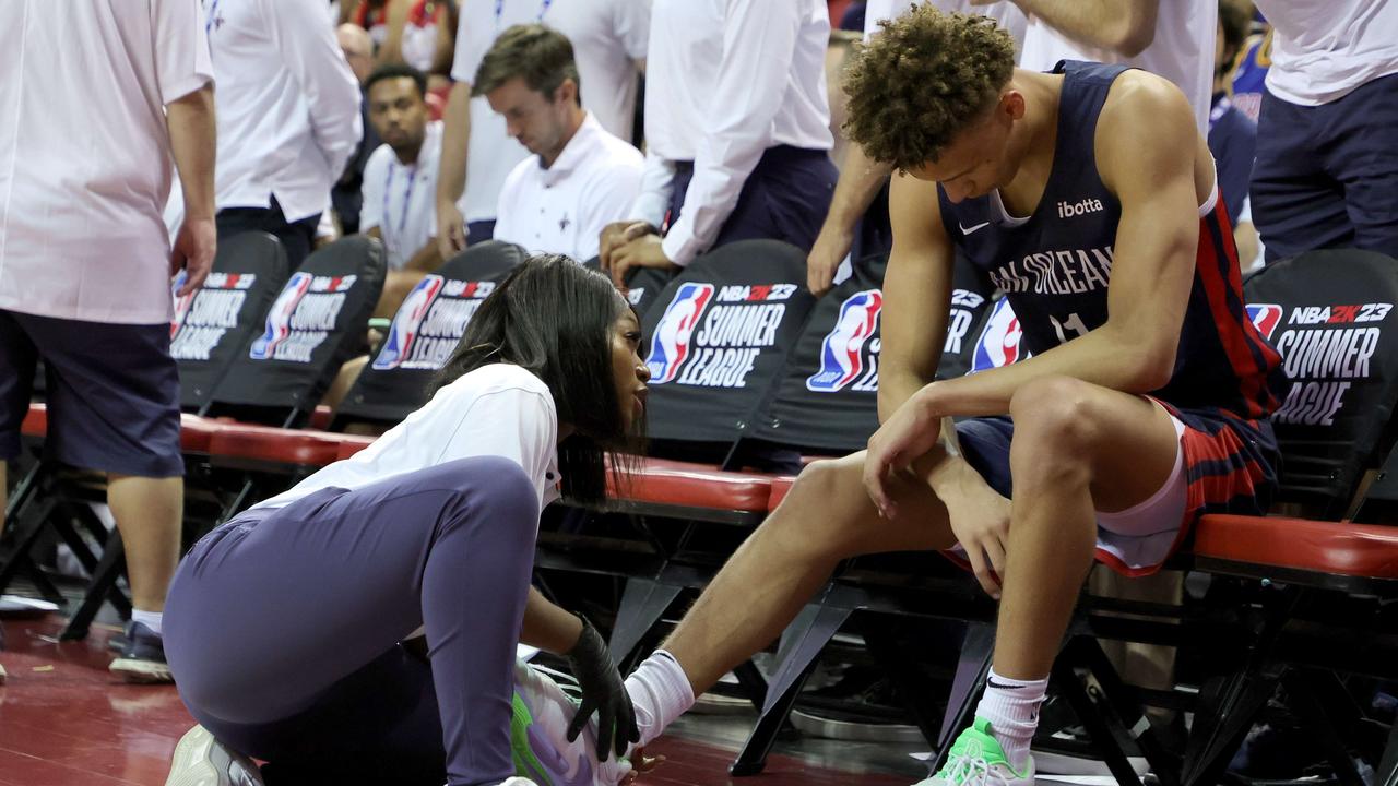 LAS VEGAS, NEVADA - JULY 09: Dyson Daniels #11 of the New Orleans Pelicans is tended to after being injured during a game against the Portland Trail Blazers during the 2022 NBA Summer League at the Thomas &amp; Mack Center on July 09, 2022 in Las Vegas, Nevada. NOTE TO USER: User expressly acknowledges and agrees that, by downloading and or using this photograph, User is consenting to the terms and conditions of the Getty Images License Agreement. Ethan Miller/Getty Images/AFP == FOR NEWSPAPERS, INTERNET, TELCOS &amp; TELEVISION USE ONLY ==