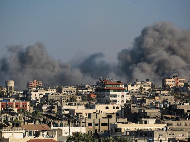 Smoke billows during Israeli airstrikes on areas southeast of Deir el-Balah city on August 24, 2024, amid the ongoing conflict between Israel and the Palestinian Hamas militant group. (Photo by Bashar TALEB / AFP)