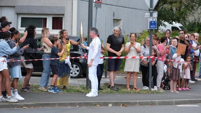 Nine CEO Mike Sneesby carrying the Paris Olympics torch in the Olympic torch relay. Picture: Jacquelin Magnay