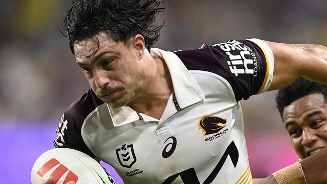 TOWNSVILLE, AUSTRALIA - AUGUST 10: Kotoni Staggs of the Broncos is tackled during the round 23 NRL match between North Queensland Cowboys and Brisbane Broncos at Qld Country Bank Stadium, on August 10, 2024, in Townsville, Australia. (Photo by Ian Hitchcock/Getty Images)