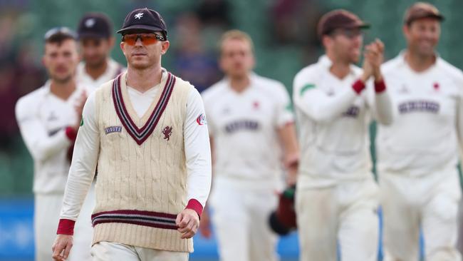 Chris Rogers walks off a cricket field for the final time.