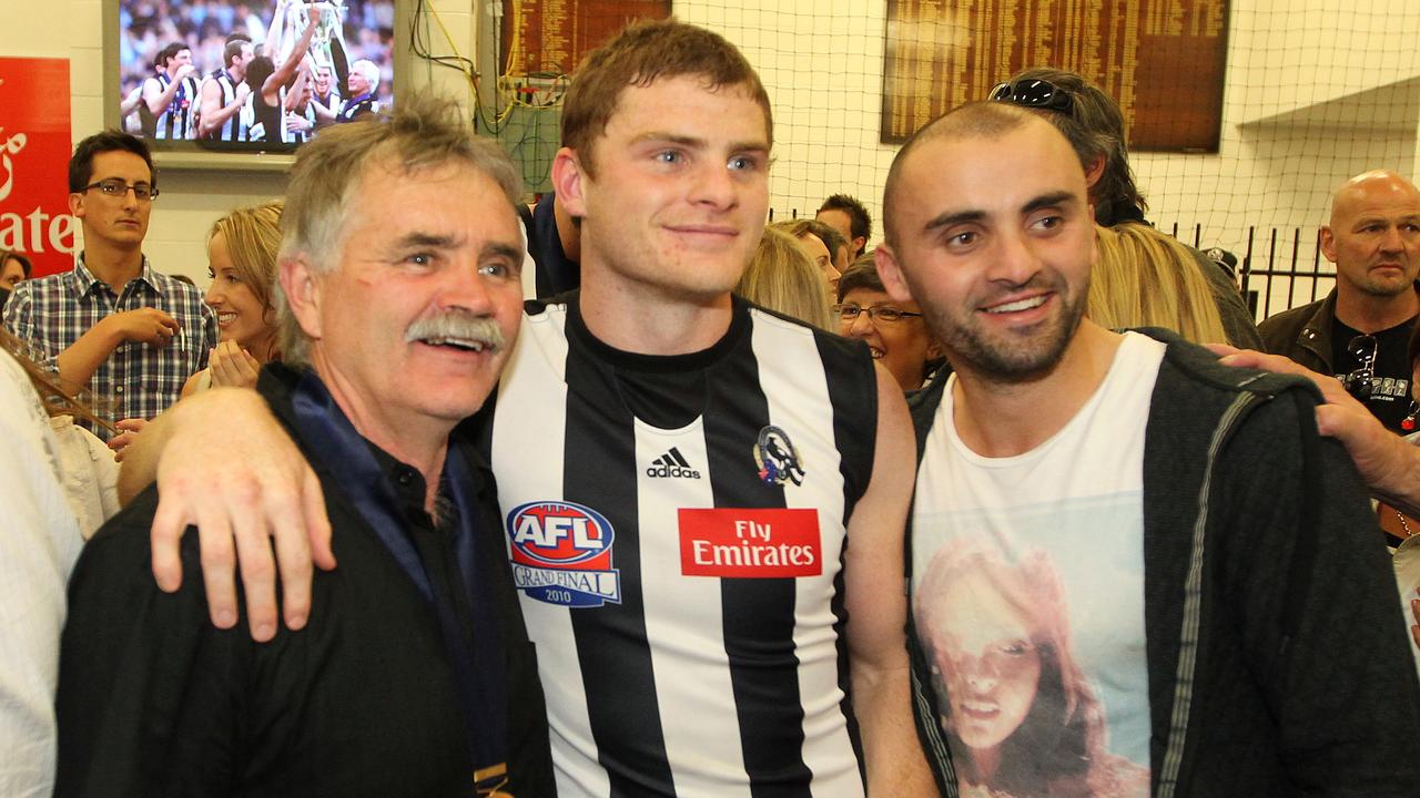 Ray, Heath and Rhyce Shaw celebrate the 2010 flag.