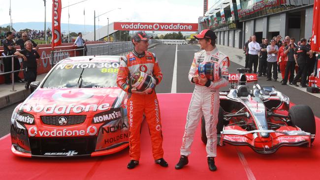 British Formula One driver Jenson Button, right, and V8 Supercar driver Craig Lowndes at Mount Panorama, Bathurst.