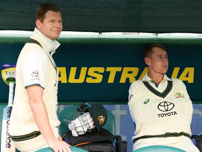 MELBOURNE, AUSTRALIA - DECEMBER 26: Steven Smith and Marnus Labuschagne of Australia prepare to bat after the rain delay during day one of the Second Test Match between Australia and Pakistan at Melbourne Cricket Ground on December 26, 2023 in Melbourne, Australia. (Photo by Robert Cianflone/Getty Images)